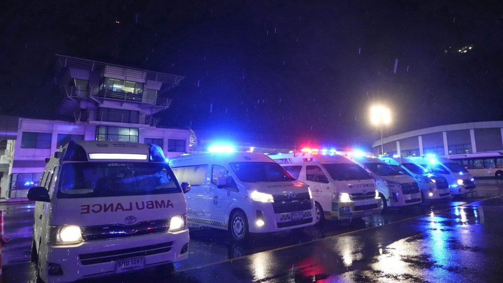 Ambulances wait to carry passengers from a London-Singapore flight that encountered severe turbulence, in Bangkok, Thailand, Tuesday, May 21, 2024. The plane apparently plummeted for a number of minutes before it was diverted to Bangkok, where emergency crews rushed to help injured passengers amid stormy weather, Singapore Airlines said Tuesday. (AP Photo/Sakchai Lalit) SLX101