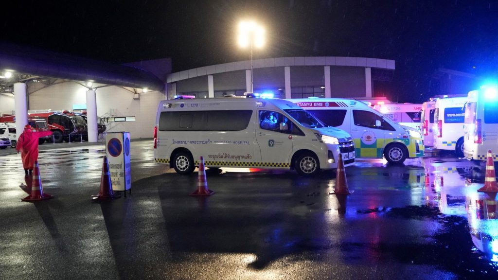 Ambulances wait to carry passengers from a London-Singapore flight that encountered severe turbulence, in Bangkok, Thailand, Tuesday, May 21, 2024. The plane apparently plummeted for a number of minutes before it was diverted to Bangkok, where emergency crews rushed to help injured passengers amid stormy weather, Singapore Airlines said Tuesday. (AP Photo/Sakchai Lalit) SLX102
