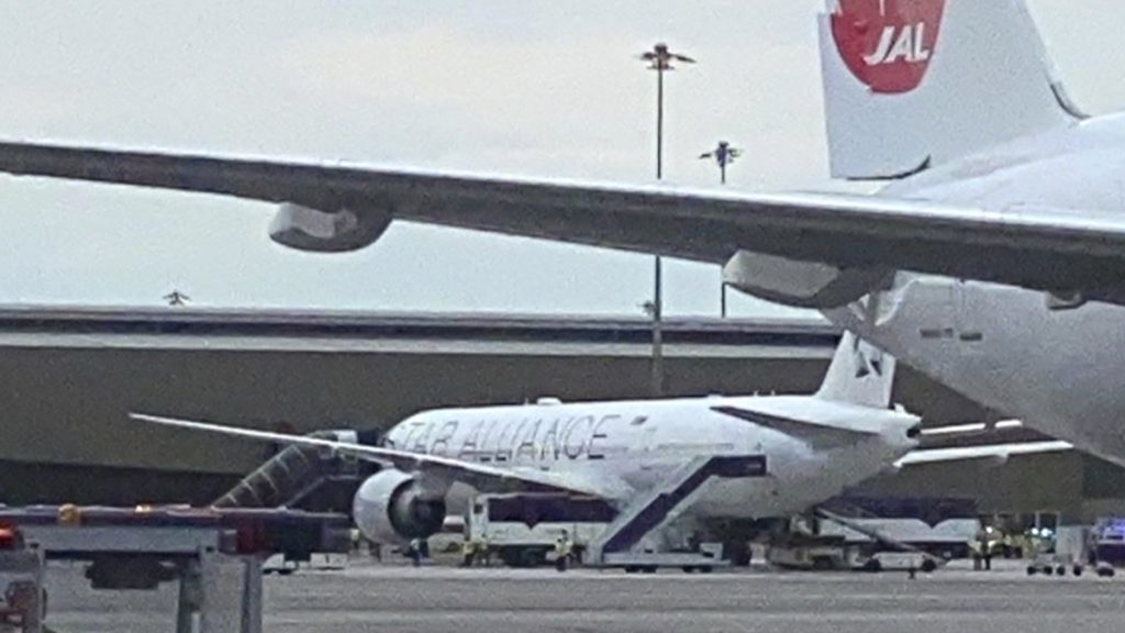 The Boeing 777-300ER aircraft of Singapore Airlines, flight SQ321 from Heathrow is seen on tarmac after requesting an emergency landing at Bangkok's Suvarnabhumi International airport, Thailand, Tuesday, May 21, 2024. One person has died aboard a London-Singapore flight that encountered severe turbulence, Singapore Airlines said Tuesday, in which the plane apparently plummeted for a number of minutes before it was diverted to Bangkok, where emergency crews rushed to help injured passengers amid stormy weather. (Pongsakorn Rodphai via AP) XPAG260