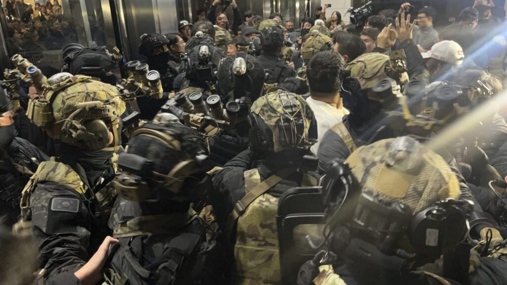 South Korean martial law soldiers try to enter the National Assembly compound in Seoul, South Korea, Wednesday, Dec. 4, 2024. (Cho Jung-woo/Newsis via AP) SEL801
