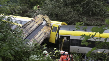 Rescue workers search for passengers in a derailed train, Zwiefaltendorf, Sunday July 27, 2025. (Thomas Warnack/dpa via AP)  LBJ121