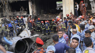 Firemen look for the survivors after a Bangladesh Air Force training aircraft that crashed onto a school campus shortly after takeoff in Dhaka, Bangladesh, Monday, July 21, 2025. (AP Photo/Mahmud Hossain Opu) OPU103