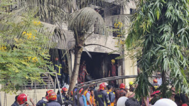 Firemen check the wreckage of a Bangladesh Air Force training aircraft that crashed onto a school campus in Dhaka, Bangladesh, Monday, July 21, 2025. (AP Photo/Mahmud Hossain Opu) OPU101