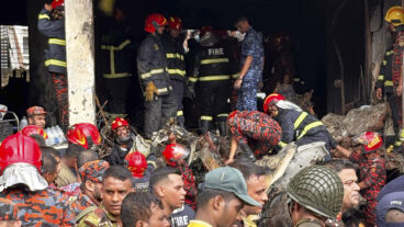 Firemen check the wreckage of a Bangladesh Air Force training aircraft that crashed onto a school campus in Dhaka, Bangladesh, Monday, July 21, 2025. (AP Photo/Al-emrun Garjon) GAR102