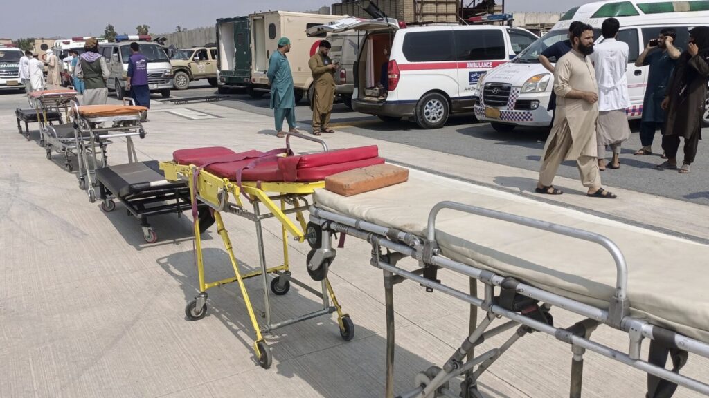 In this photo released by the Nangarhar Media Center, stretchers and ambulances are prepared to receive victims of an earthquake that killed hundreds and destroyed numerous villages in eastern Afghanistan, at Nangarhar Airport in Nangarhar, Afghanistan, Monday, Sept. 1, 2025. (Nangarhar Media Center via AP) XEM103