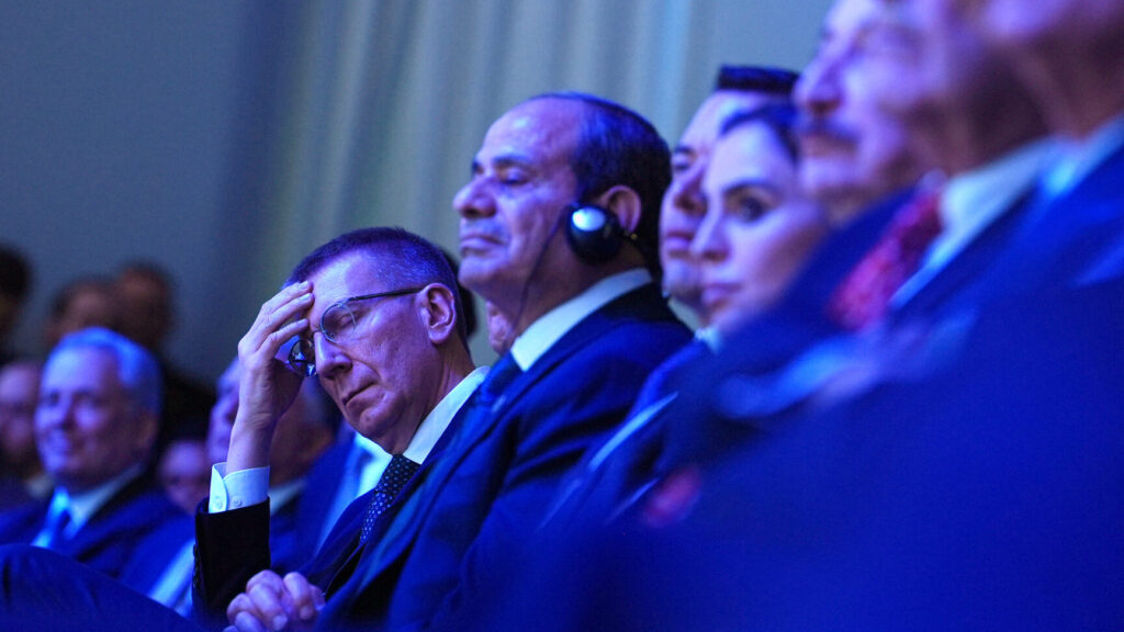 Latvia's President Edgars Rinkevics, center left, listsns to the address of President Donald Trump during the Annual Meeting of the World Economic Forum in Davos, Switzerland, Wednesday, Jan. 21, 2026. (AP Photo/Evan Vucci) XVM148