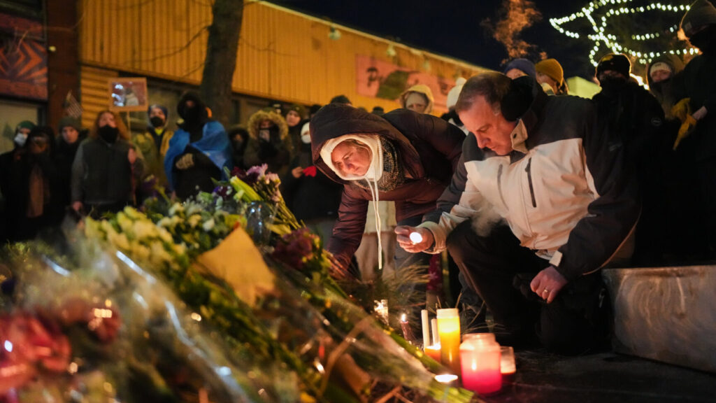 People gather during a vigil for 37-year-old Alex Pretti, who was fatally shot by a U.S. Border Patrol officer earlier in the day, Saturday, Jan. 24, 2026, in Minneapolis. (AP Photo/Adam Gray) MNSS617