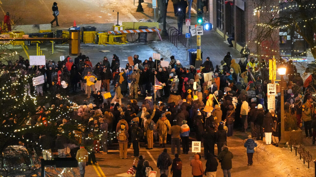 People gather during a vigil for 37-year-old Alex Pretti, who was fatally shot by a U.S. Border Patrol officer earlier in the day, Saturday, Jan. 24, 2026, in Minneapolis. (AP Photo/Adam Gray) MNSS625