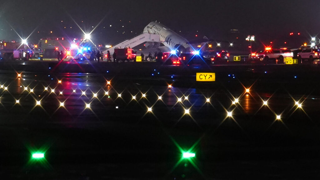 An Air Canada Jet sits on the runway at LaGuardia Airport, Monday, March 23, 2026, after colliding with a Port Authority vehicle in New York. (AP Photo/Ryan Murphy) NYJJ102