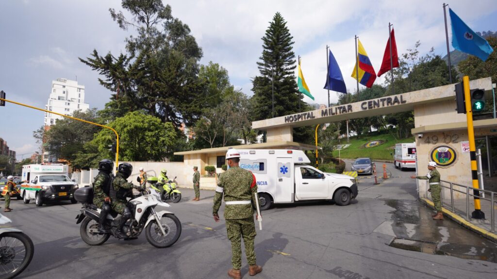 Ambulances carrying people who were injured on a military cargo plane that crashed shortly after takeoff in Puerto Leguizamo arrive at the Military Hospital in Bogota, Colombia, Monday, March 23, 2026. (AP Photo/Ivan Valencia) COFV105