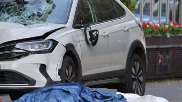 A damaged car that has crashed into several people is pictured in Leipzig, Germany, Monday, May 4, 2026. (Sebastian Willnow/dpa via AP)  DSOB104