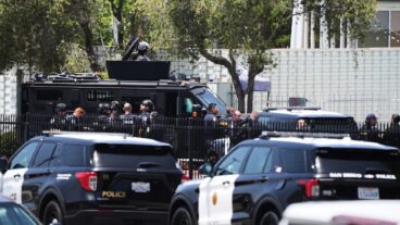 Police stage at the scene of a shooting outside the Islamic Center of San Diego Monday, May 18, 2026, in San Diego. (AP Photo/Gregory Bull)  LA110