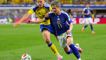 Japan's Daizen Maeda, right, and Sweden's Gustaf Lagerbielke battle for the ball during the World Cup Group F soccer match in Arlington, Texas, near Dallas, Thursday, June 25, 2026. (AP Photo/Julio Cortez)  WCFL132