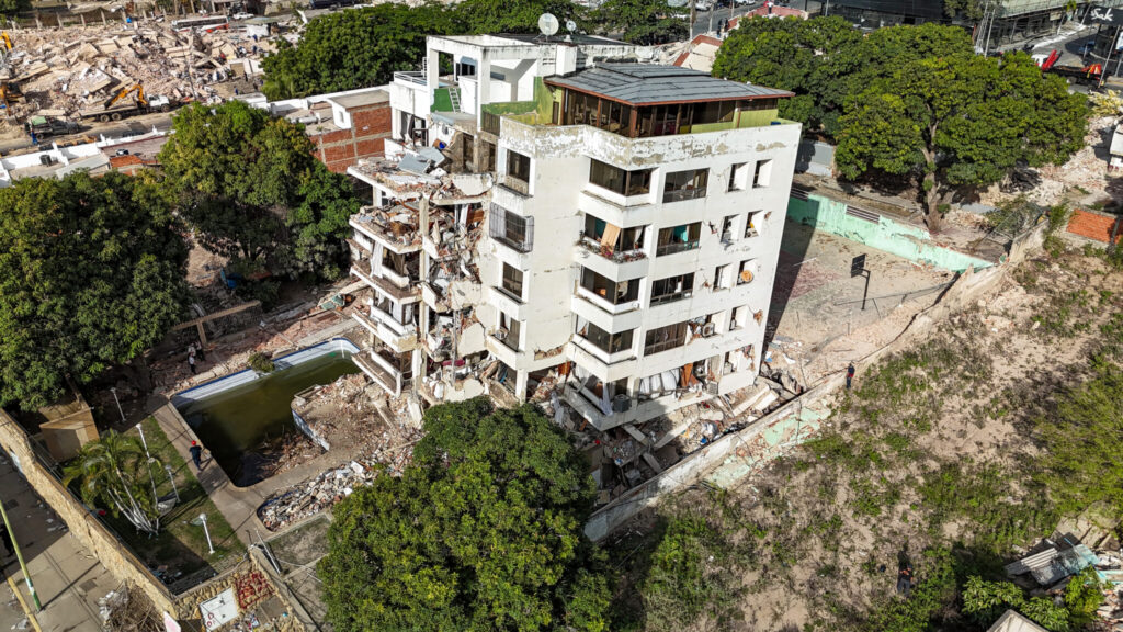 This aerial picture shows a building destroyed during twin earthquakes, in Caraballeda, La Guaira state, Venezuela, on Saturday, June 27, 2026. (Miguel Medina/Pool Photo via AP) vemm612