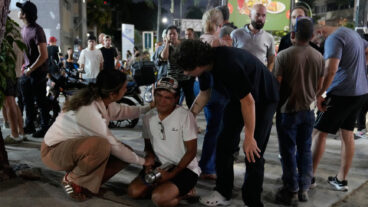 Residents console a man outside their homes after successive earthquakes, in Caracas, Venezuela, Wednesday, June 24, 2026. (AP Photo/Ariana Cubillos)  XRM446