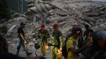 Soldiers guard an area damaged by the earthquakes in La Guaira, Venezuela, Saturday, June 27, 2026. (AP Photo/Matias Delacroix)  XRM730