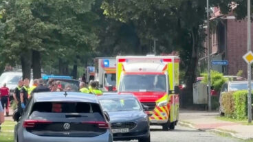In this image taken from a video, emergency responders, residents and police in Stade, Germany, Monday, June 29, 2026 after five people were killed in a shooting on Monday at a youth welfare facility in the northern German town of Stade, police said. (NWM-TV via AP)  xfp102