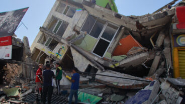 Residents search through the rubble after an earthquake struck Pereira, Colombia, Monday, Aug. 10, 2026. (AP Photo/Miguel Angel Lopez)  XRM887